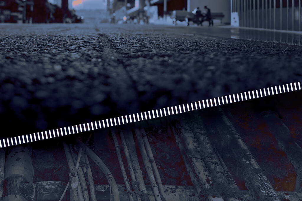 Low angle view of downtown Toronto street superimposed above photo of cables, pipes and sewage under pedestrian walkway